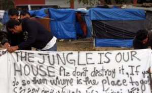 inmigrantes pancarta jungla